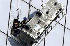 rescatan a dos limpiavidrios, torre World Trade Center, andamio colgante rescata obreros